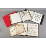 A quantity of part filled stamp albums with stamps from around the world