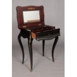 A French 19th century ebonised vanity table with brass inlaid decoration. Height 73.5cm, Width 60cm,
