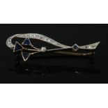 An Art Deco 15ct gold diamond and sapphire brooch. 3.16g.