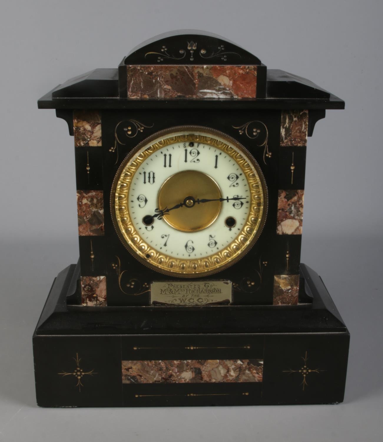 A slate and marble presentation mantle clock presented to Mr. & Mrs. Richardson by the W.C.C.