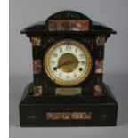 A slate and marble presentation mantle clock presented to Mr. & Mrs. Richardson by the W.C.C.