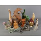 A quantity of oriental figures including large wooden dragon, various buddha examples and