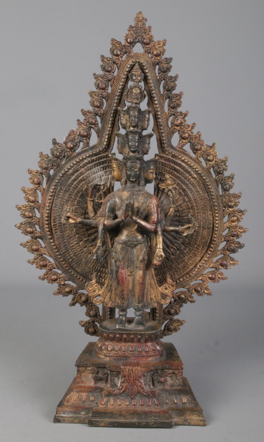 A cast metal figure formed as a thousand arm deity/Avalokiteshvara. Height 40.5cm.