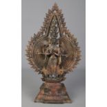 A cast metal figure formed as a thousand arm deity/Avalokiteshvara. Height 40.5cm.