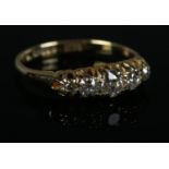 An 18ct Gold and five old stone cut diamond ring. Size K. Total weight: 2.2g