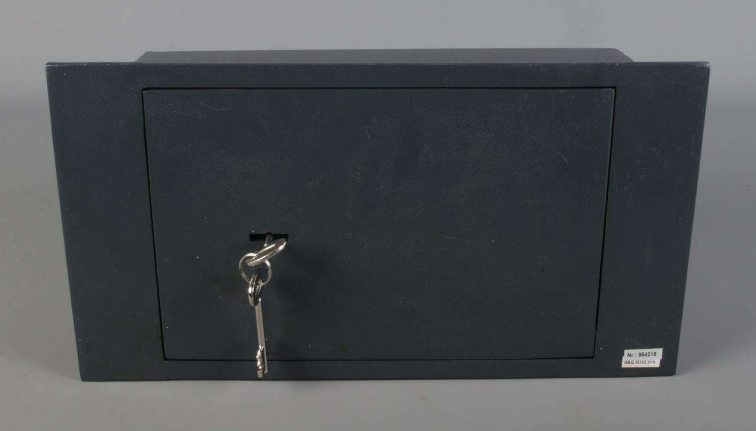 A steel underfloor/wall safe with five lever security lock and two keys