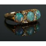 An Edwardian 18ct gold, opal and diamond ring. Size N. 3.99g.