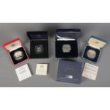 Four cased Royal Mint silver coins. Includes Queen Elizabeth The Queen Mother Centenary Year
