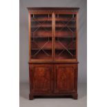 A large Victorian mahogany bookcase with astragal glazed top over cupboard base. Height 216cm, Width