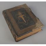 A leather brass bound Douay Family Bible, published by James Duffy and Co Limited.