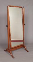 An Edwardian walnut cheval mirror. Height 151.5cm, Width 71cm.