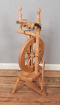 A modern pine spinning wheel.