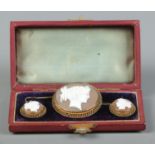 An 18ct gold cameo jewellery suite in fitted box, consisting of brooch and pair of drop earrings.