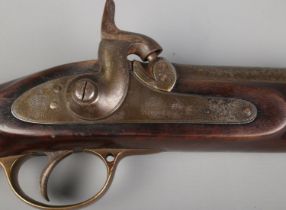 A 19th century Tower two band percussion rifle. Stamped 1859 Tower and stamped VR to lock plate.