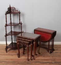 A corner whatnot with four graduated shelves including nest of tables with burr walnut tops and