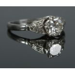 An Art Deco platinum and diamond ring. Size L. 3.18g. Central diamond just over 0.5ct.