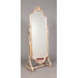 A decorative carved silvered giltwood cheval mirror. Height 175cm, Width 72cm.