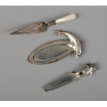 Three silver bookmarks to include dolphin, bear and mother of pearl handled examples. Total weight