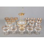 A quantity of gold rimmed glass. Includes tumblers, Martini stirrer, etc.