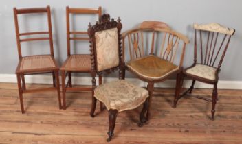 Five chairs. Includes carved mahogany hall chair, pair of Edwardian bergÃ¨re seat bedroom chairs,