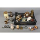 A tray of assorted collectables to include Zippo lighter, brass duck with umbrella, miners lamp,