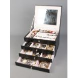 A faux leather jewellery case with contents of assorted costume jewellery to include Abalone ring,