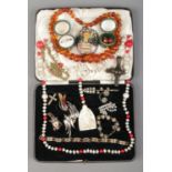 A cutlery tray containing a collection of assorted jewellery. To include faceted amber/copal