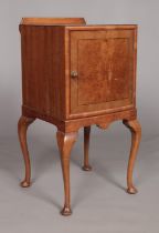 An Edwardian walnut bedside cabinet raised on four cabriole supports. Height 80cm, Width 42cm, Depth