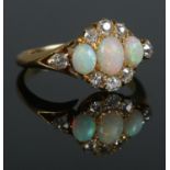 An early 20th century 18ct gold, opal and diamond cluster ring. Hallmarks for Birmingham, 1912. Size