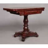 A Victorian carved mahogany fold over card table. Height 72cm, Top open 91cm x 91cm.