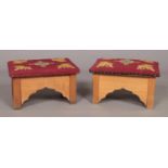 A small pair of oak prayer stools with embroided seats. Height 30cm, Width 48cm, Depth 32cm.