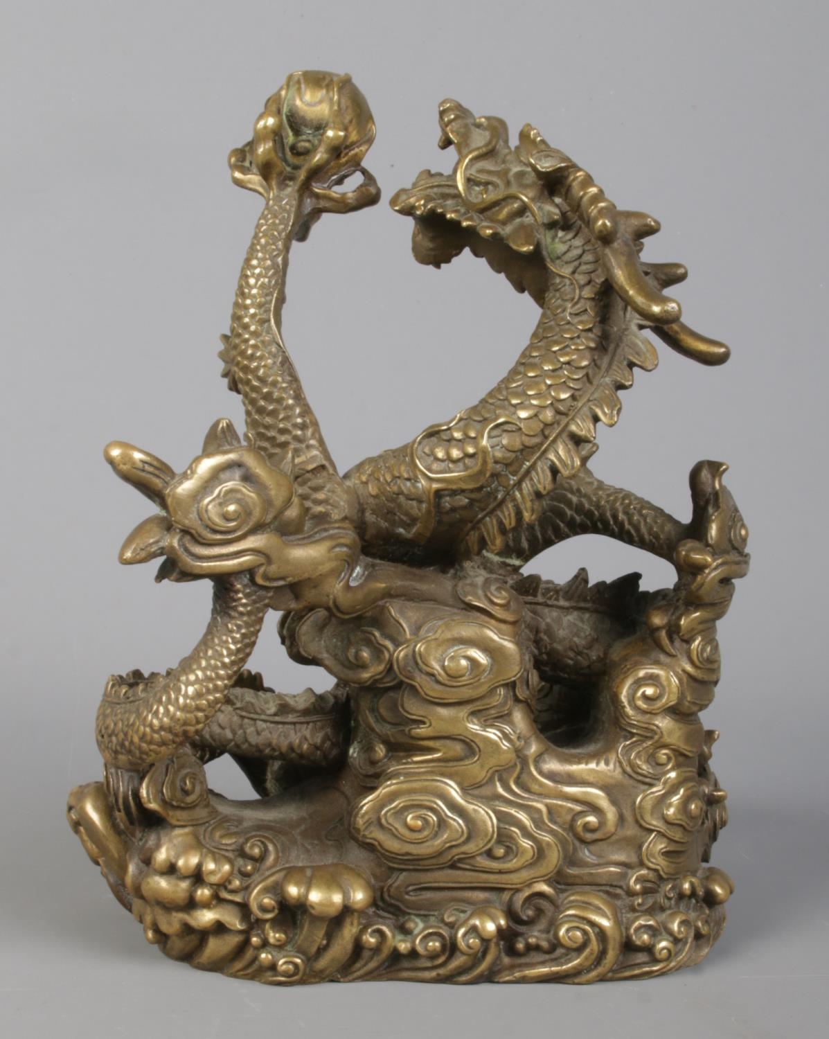 A cast bronze sculpture of a Chinese dragon holding a flaming pearl. Height 18cm. - Image 4 of 5