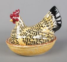 An Emma Bridgewater hen egg basket in the Black Toast pattern.