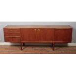 An A H McIntosh & Company teak sideboard, with arrangement of three drawers, two central cupboard