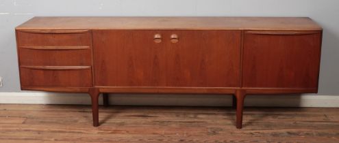 An A H McIntosh & Company teak sideboard, with arrangement of three drawers, two central cupboard