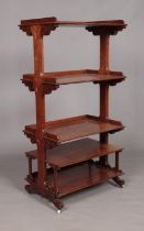 A Victorian carved mahogany five tier Etagere. Height 136cm, Width 69cm, Depth 45cm.