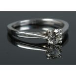 An 18ct white gold diamond solitaire ring. The round brilliant cut diamond 0.5ct. With