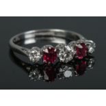 An early 20th century platinum, diamond and ruby five stone ring. Size L. 2.59g.