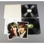 The Beatles White Album No. 0313402 top opening stereo pressing. Includes original poster and two of