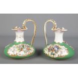 A pair of 19th century Derby Bloor ewers, green ground with applied flowers and gilt decoration.