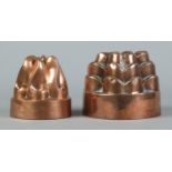 Two Victorian copper jelly moulds. Diameters 13cm and 11cm.
