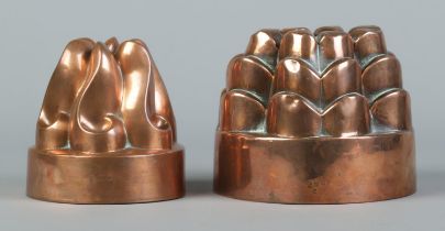 Two Victorian copper jelly moulds. Diameters 13cm and 11cm.