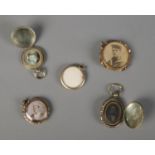A selection of five lockets including military example.