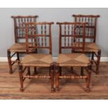 A set of four spindle back chairs with rush seats.
