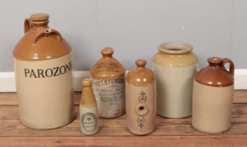 A collection of stoneware flagons to include Watt & Ferguson and Wath stamped examples.