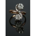 An antique gold two stone diamond ring. Each stone approximately 0.5ct. Size L 1/2. 4.94g.