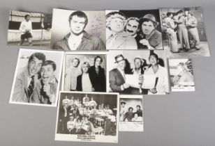 A quantity of monochrome photographs and film stills, some signed. Autographed Dean Martin, The