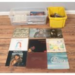 A box of assorted vinyl records and one box of singles, mainly pop and easy listening. To include