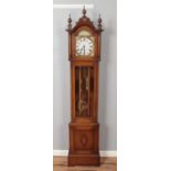 A carved oak longcase clock with turned finials. (211cm x 45cm)