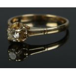 An 18ct diamond solitaire ring. Size P.